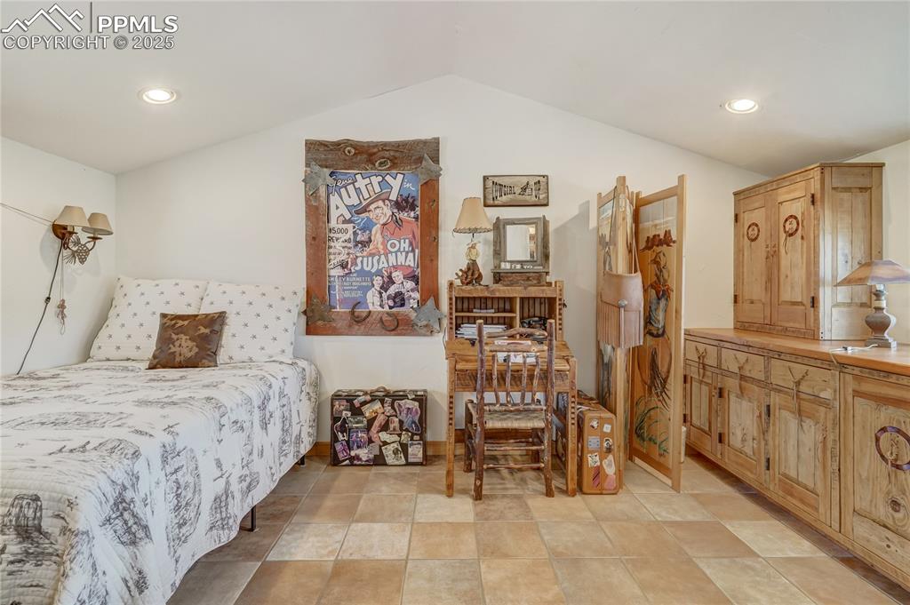 Image 37 of 50: Bedroom with recessed lighting and vaulted ceiling