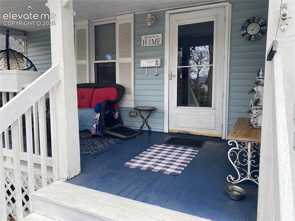 Image 12 of 25: Designed for year-round enjoyment, the porch provides the perfect spot to s