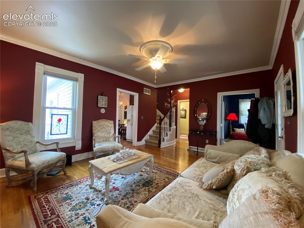 Image 14 of 25: Elegant crown molding provides a sophisticated touch, enhancing the timeles