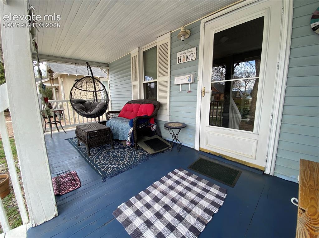 Image 2 of 25: Check out this HUGE front porch - almost 130 sq ft of covered outdoor livin