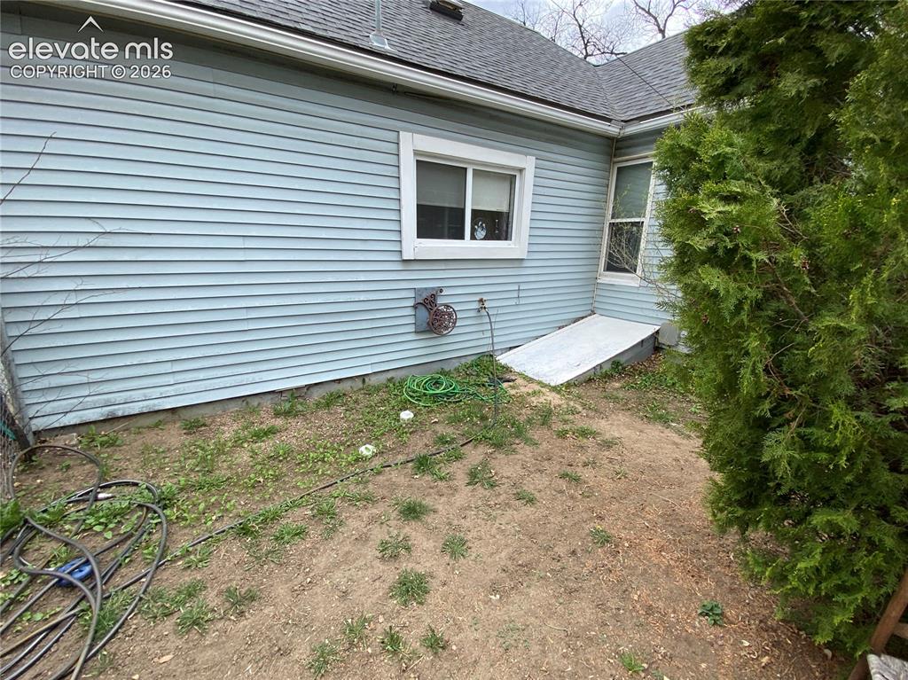 Image 20 of 25: Additional storage can be found in the basement crawl space, which features