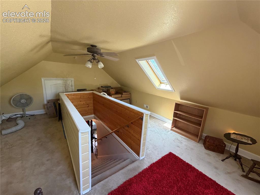 Image 22 of 25: The bonus upstairs loft provides a getaway space and also access to additio