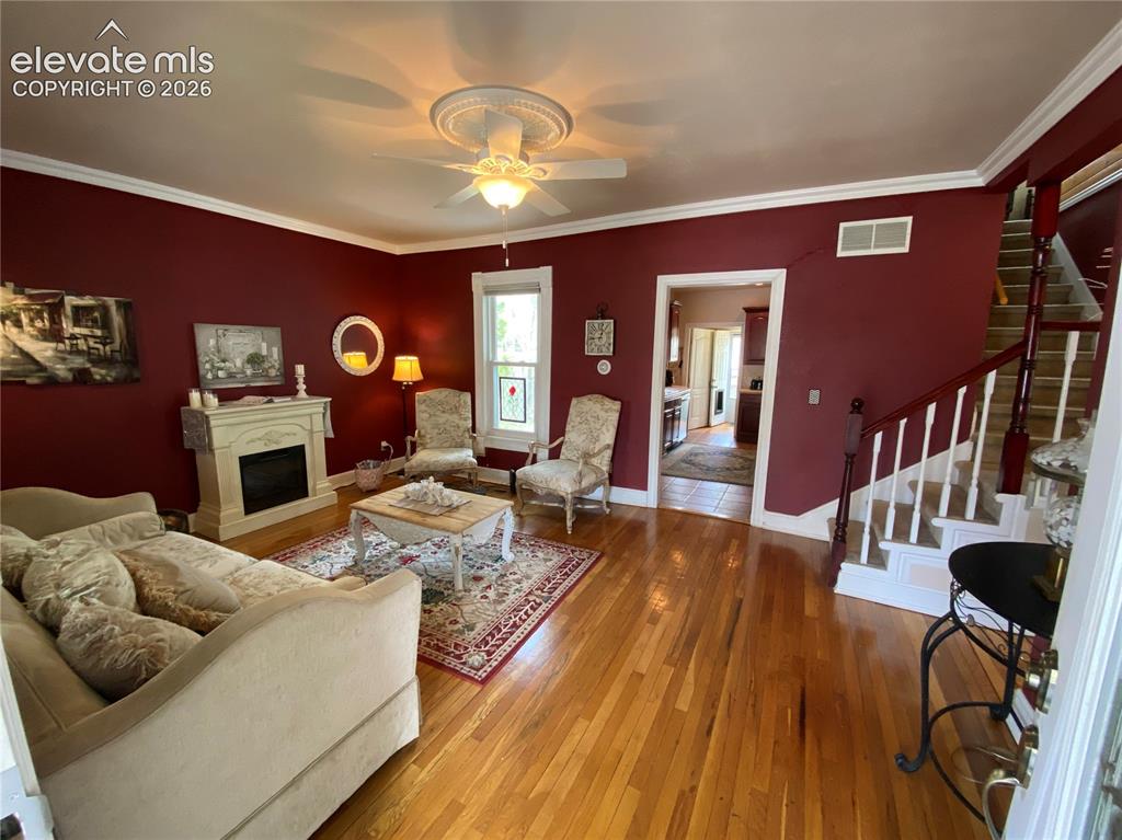 Image 3 of 25: The parlor living room welcomes you with classic architectural details