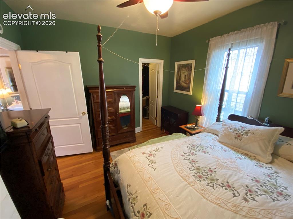 Image 8 of 25: The master bedroom is adjacent to the full bathroom and boasts a small walk