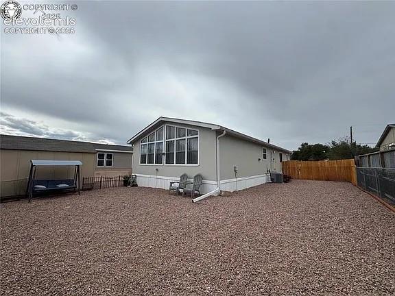 Image 1 of 34: Back of Home with large bright windows 