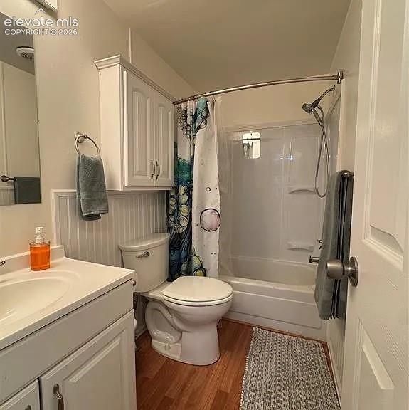 Image 22 of 34: Full bathroom featuring a single vanity, wood-finish flooring, white beadbo