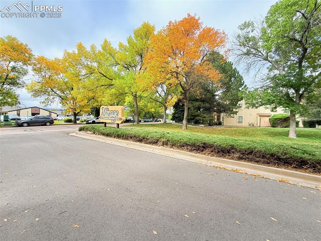 Image 33 of 35: View of asphalt road featuring curbs
