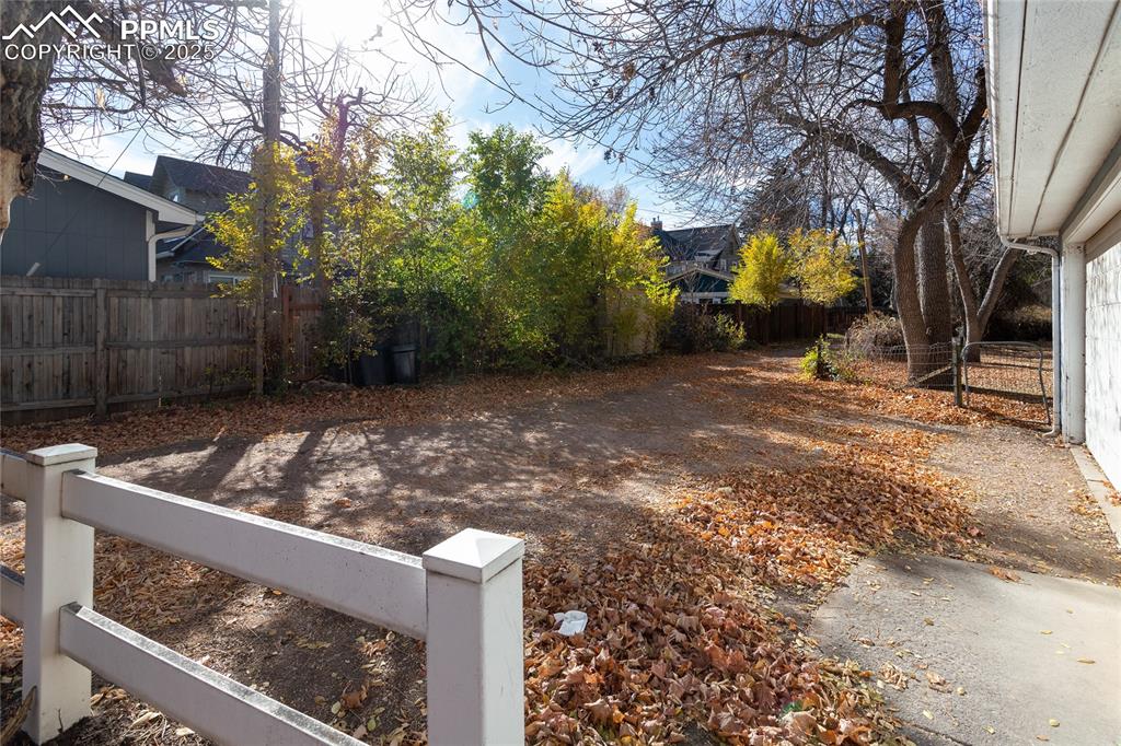 Image 22 of 24: View of fenced backyard