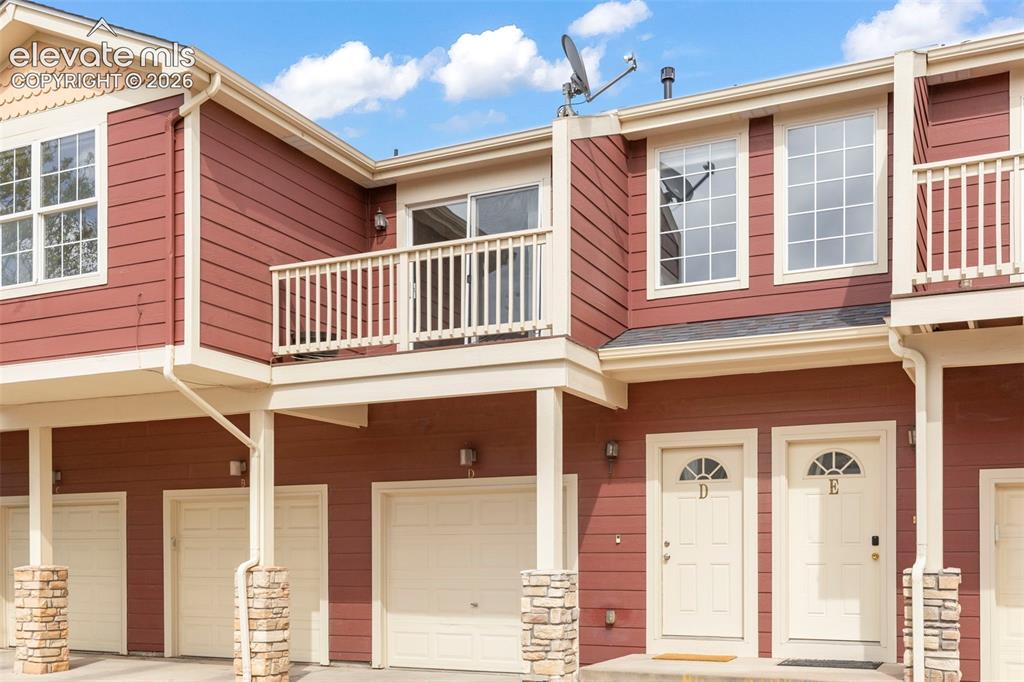 Image 1 of 22: Exterior featuring red horizontal siding with cream trim