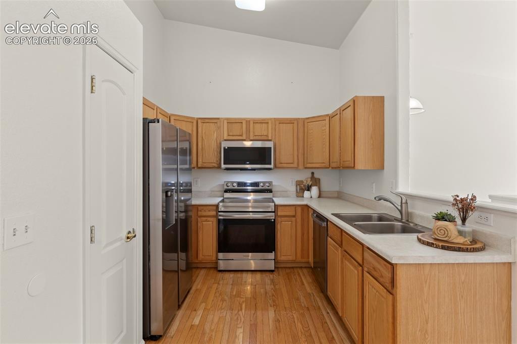 Image 5 of 22: Well-appointed kitchen featuring wood cabinetry, stainless steel appliances