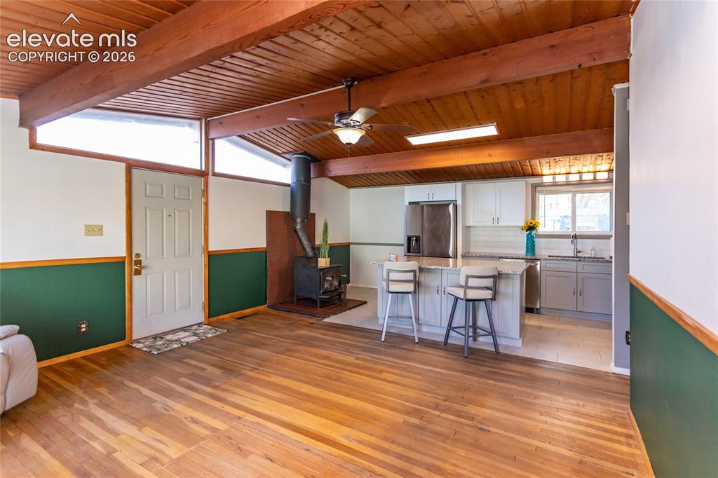 Image 12 of 40: Wood burning fireplace and small breakfast nook.