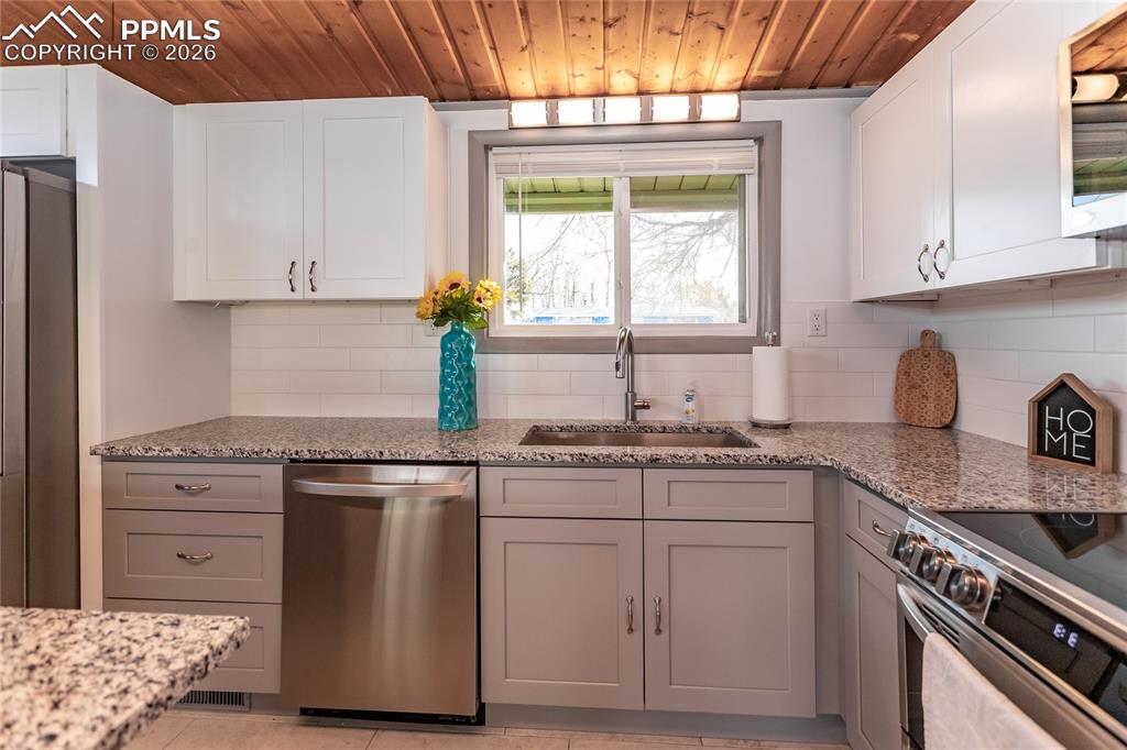 Image 13 of 36: Single basin kitchen sink.