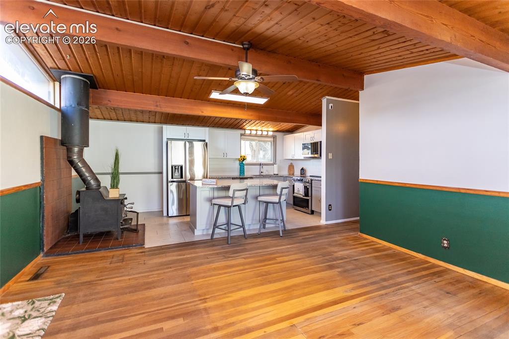Image 13 of 40: Living room to kitchen