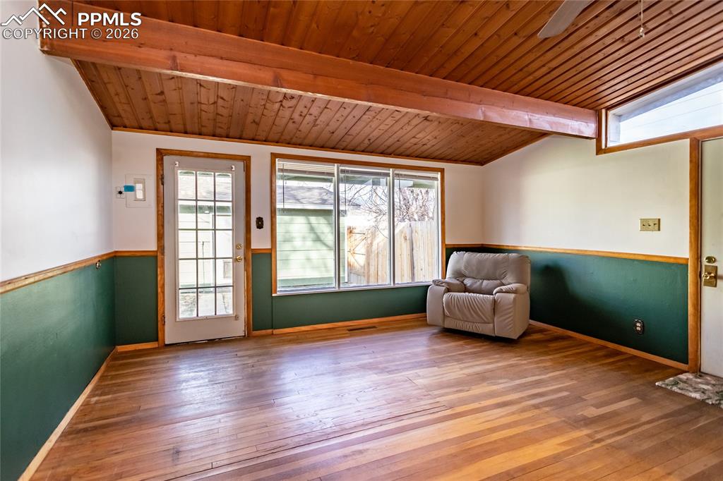 Image 16 of 36: Living room to outside patio to garage.