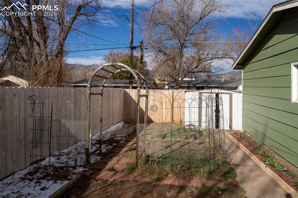 Image 34 of 36: Yard and storage shed.