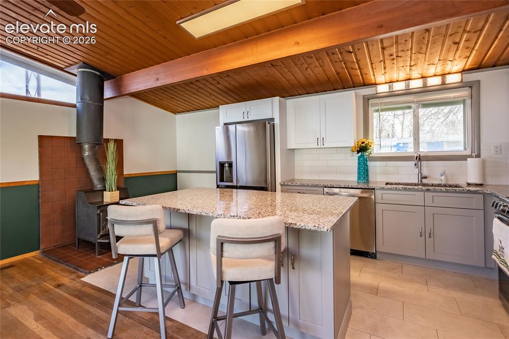 Image 6 of 40: Newly painted interior with living room that opens to newly remodeled large