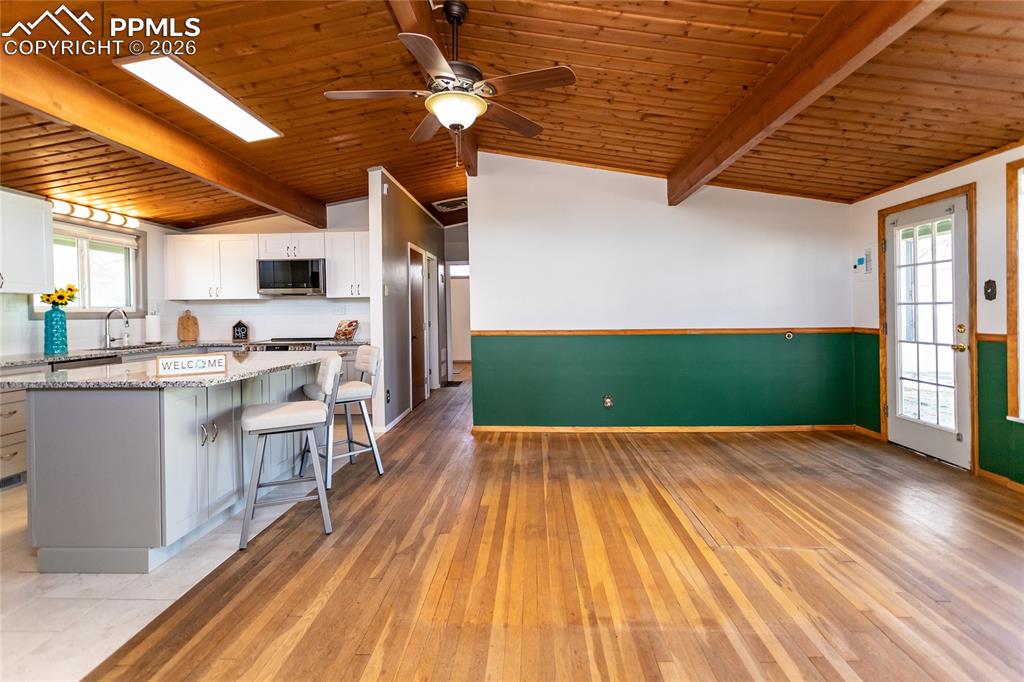 Image 8 of 36: Newly painted interior with living room that opens to newly remodeled large