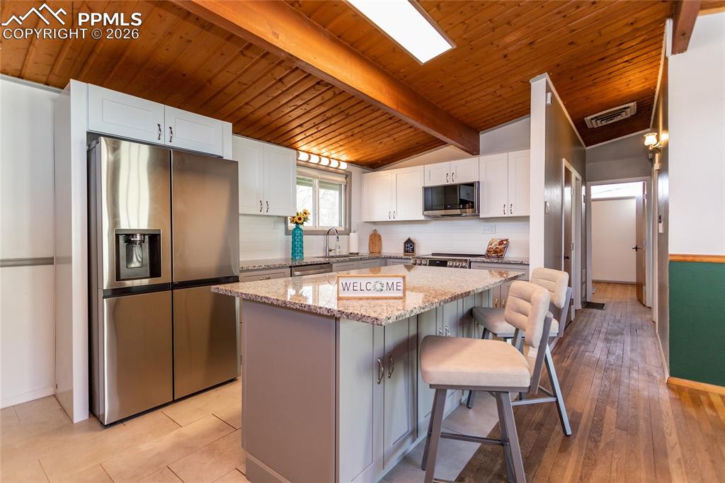 Image 9 of 36: Island with storage all around.