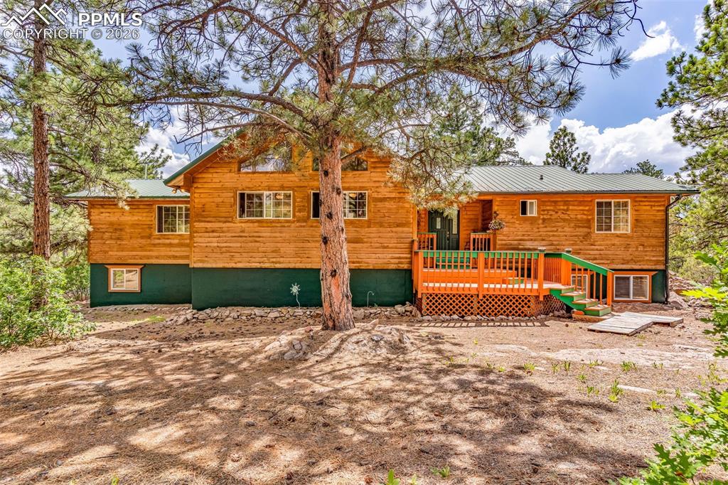 Image 1 of 49: Gorgeous mountain home surrounded by trees and breathtaking views