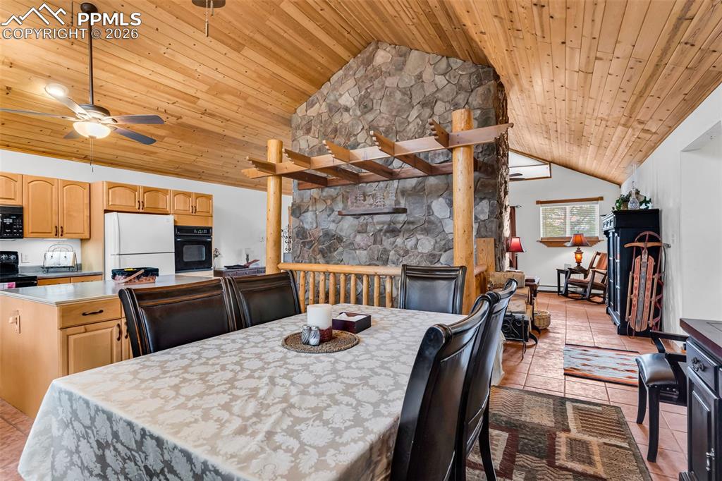 Image 11 of 49: Tons of character with a stone fireplace as the centerpiece of the main lev