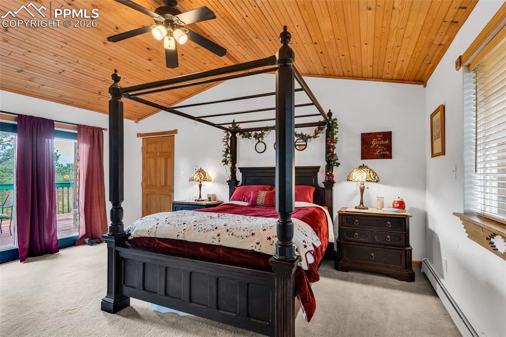 Image 22 of 49: Master bedroom with walkout to deck and incredible mountain views