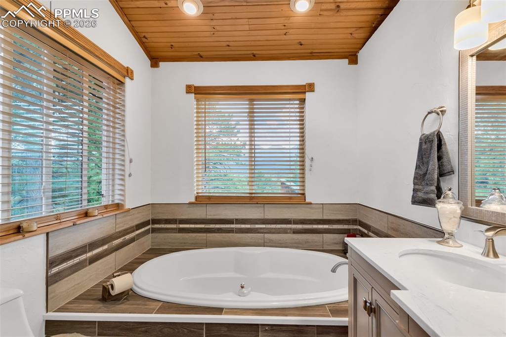 Image 24 of 49: Your retreat to relax and unwind with mountain views and tons of natural li