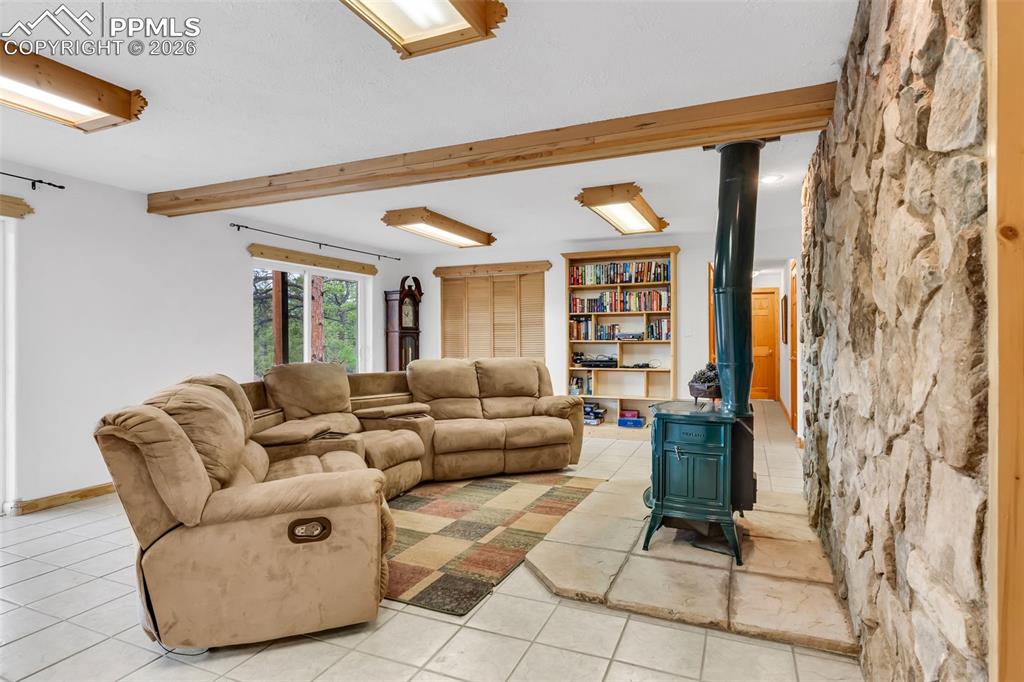 Image 33 of 49: Hallway on the right leads to 2 additional bedrooms, full bathroom, and mec
