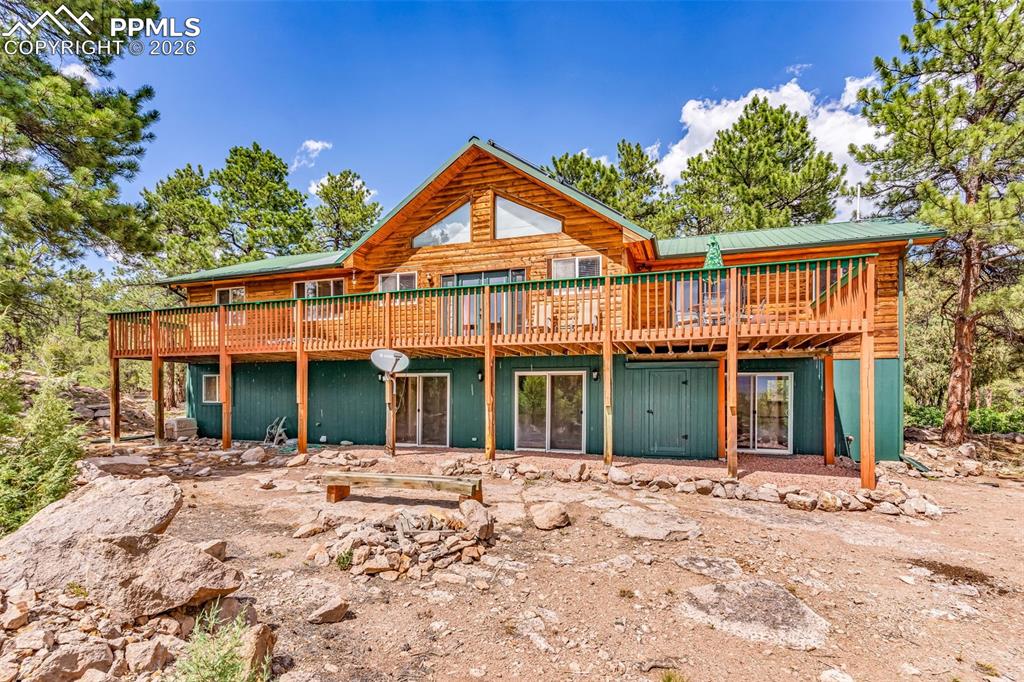 Image 4 of 49: Rear of home faces Sangre de Cristo mountains