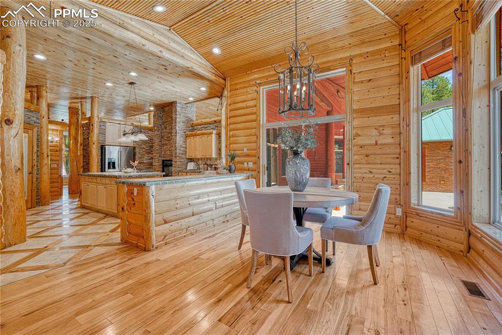 Image 16 of 50: Large dining nook with walkout access to the backyard patio