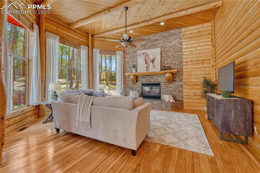Image 18 of 50: The family / great room features another gas log fireplace and a great spac