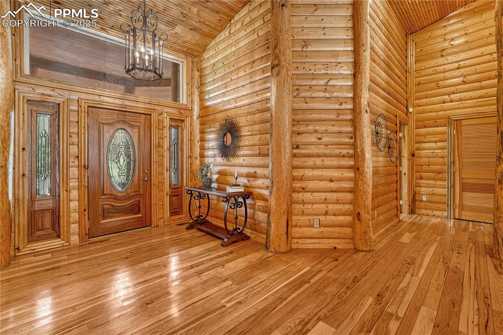 Image 20 of 50: This hallway off the entry leads to an extra bedroom, bath, and the Primary