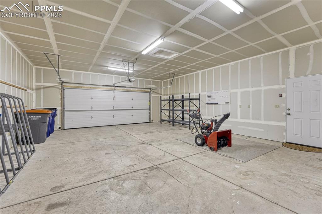 Image 46 of 50: Detached garage is insulated and drywalled within
