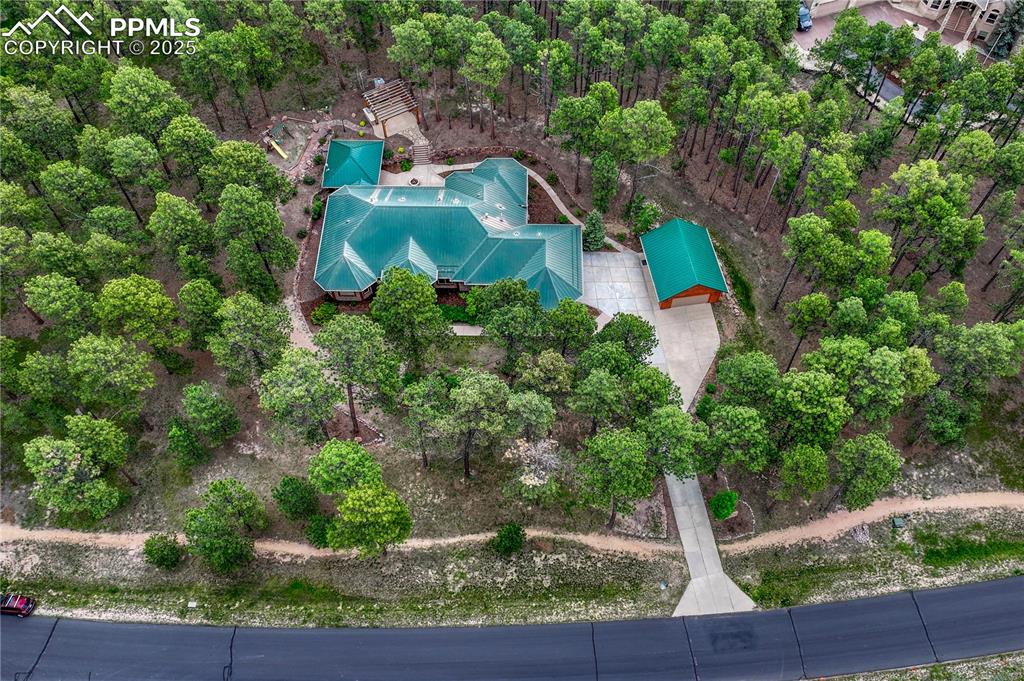 Image 49 of 50: The 2.72-acre treed lot offers privacy and the feeling of a true estate pro