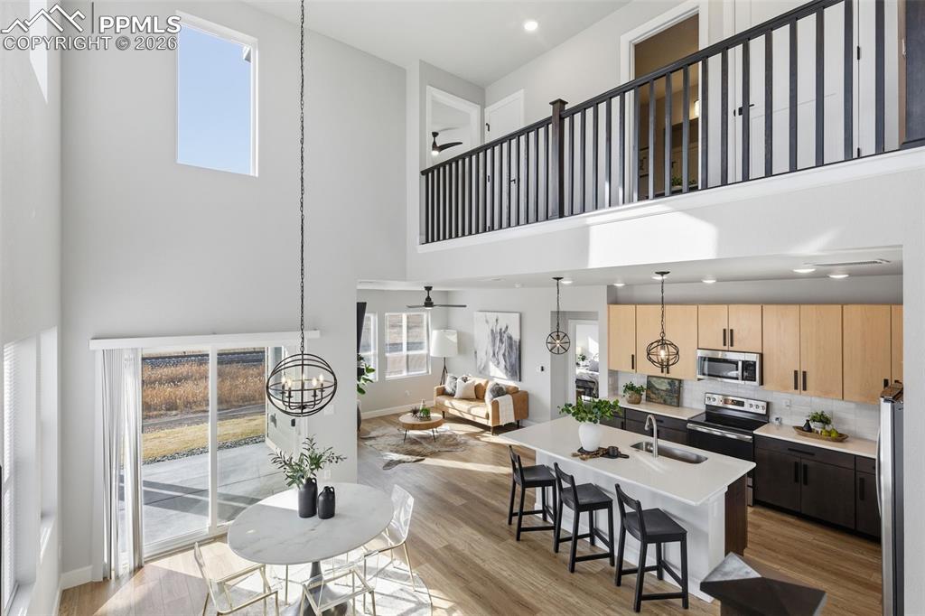 Image 15 of 47: Open floor plan with view of the loft and a feeling of airiness and light