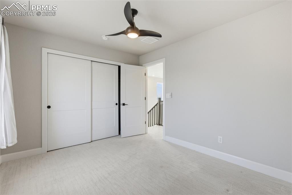 Image 30 of 47: View from 2nd bedroom to hallway area
