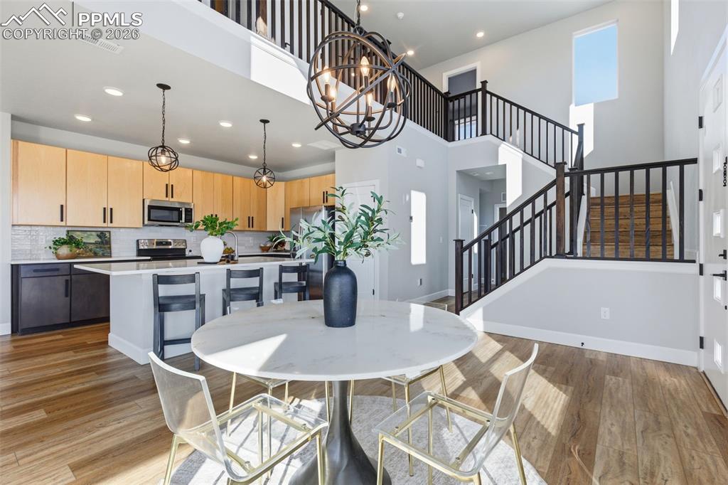 Image 7 of 47: Lots of upgrades with laminate through the first floor, stairs, baths, upsc