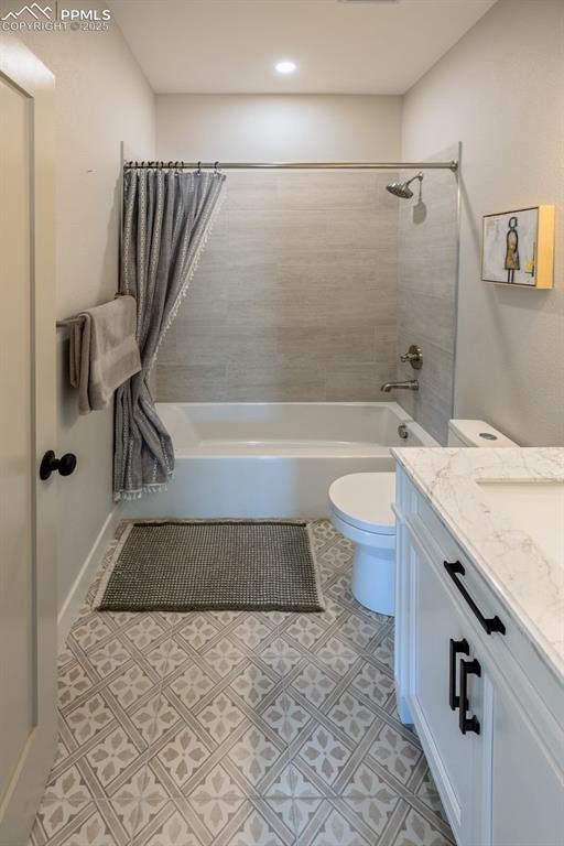 Image 10 of 21: Full bathroom featuring shower / bath combination and vanity, porcelain til