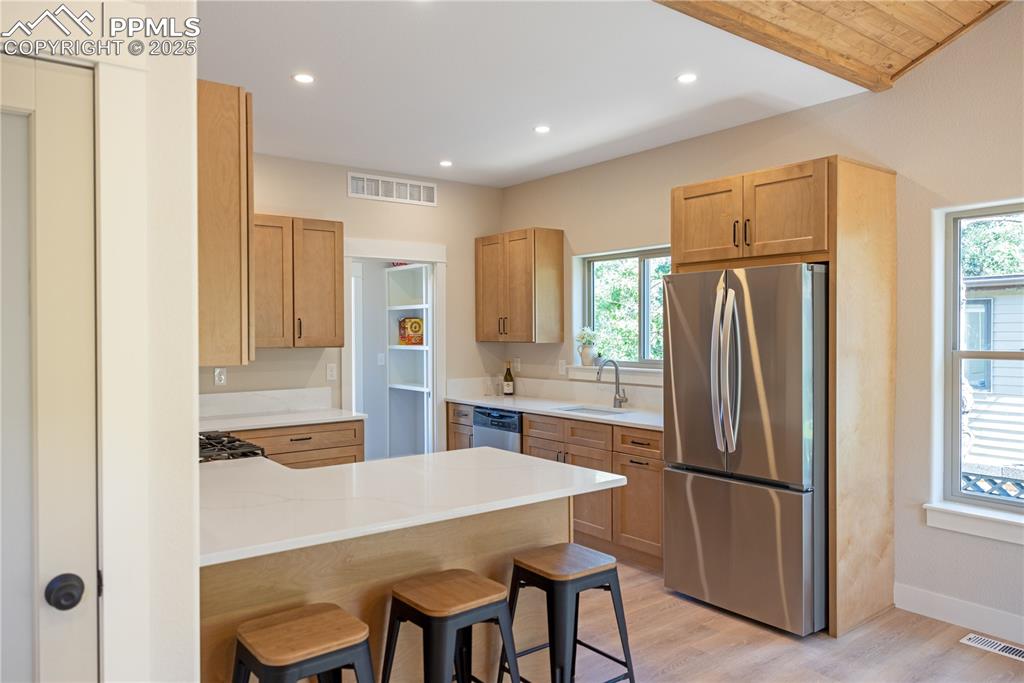 Image 7 of 21: Maple cabinets with 2 Lazy Susans, cookie sheet storage and large drawers f