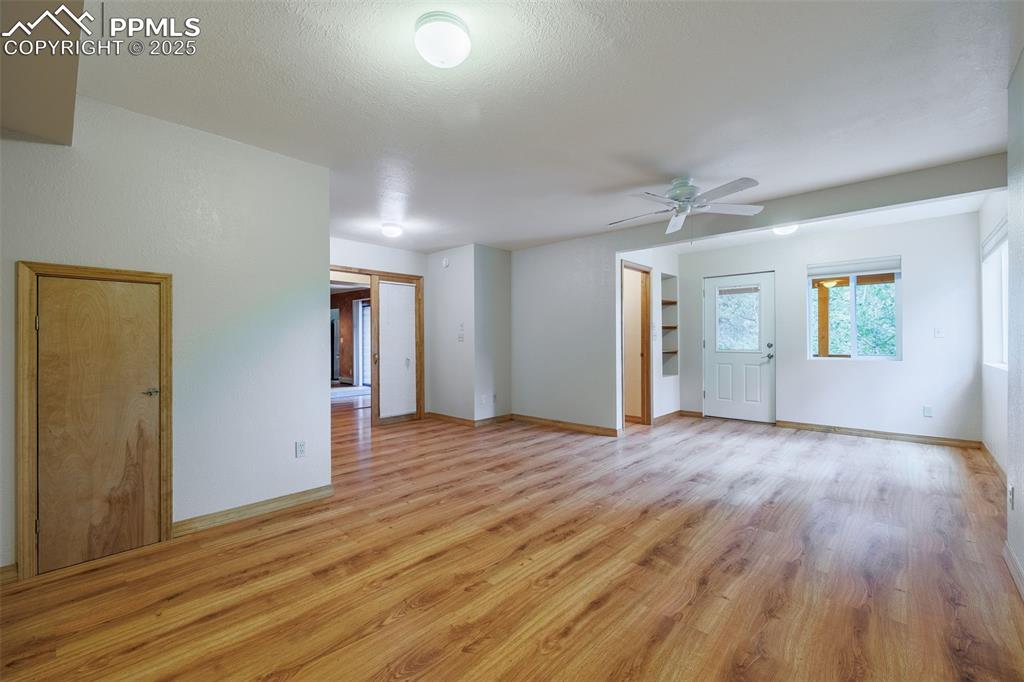 Image 13 of 32: Third main level bedroom with attached bathroom.