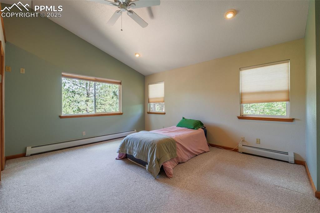 Image 22 of 32: Main level primary bedroom with attached bathroom 
