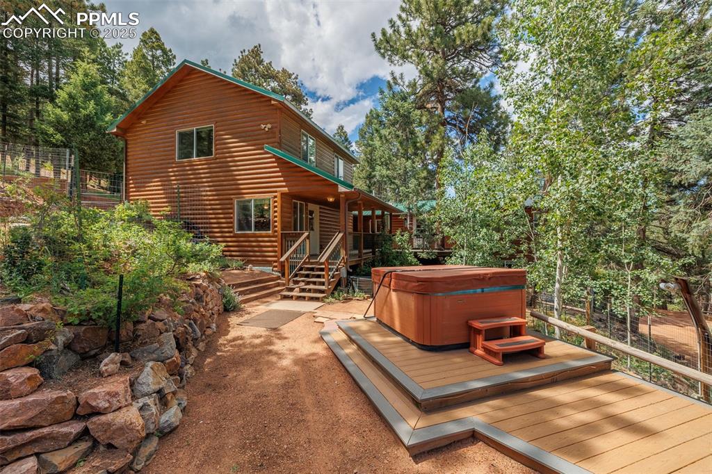 Image 3 of 32: Side view of property featuring a great place to enjoy the hot tub