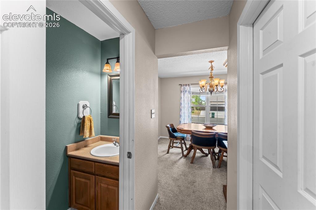 Image 15 of 45: Pass-through from kitchen to dining room