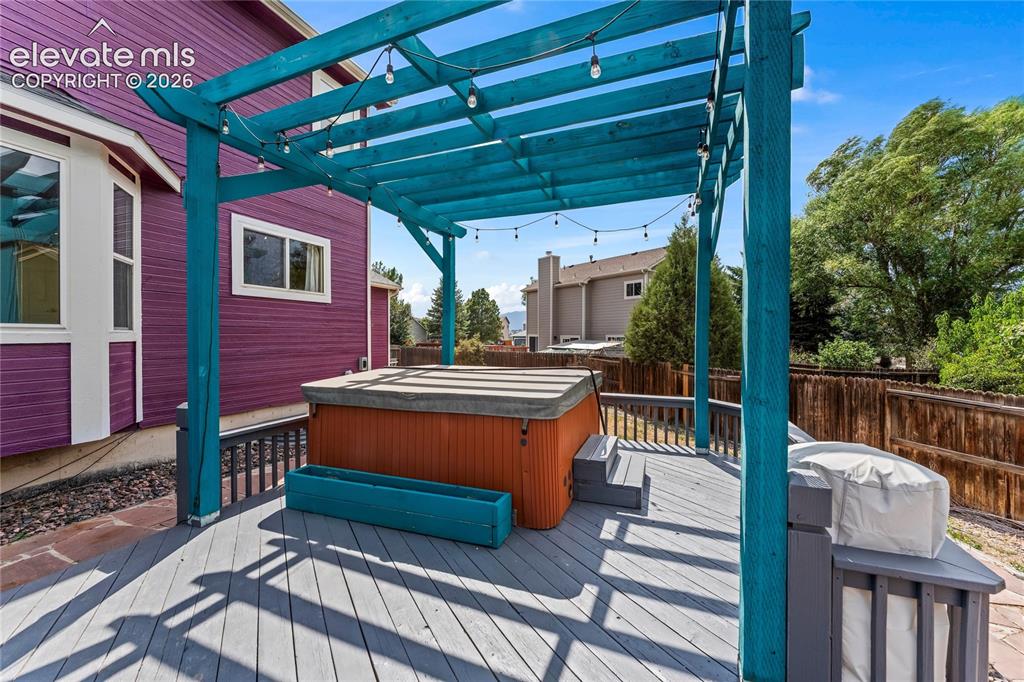 Image 37 of 45: Hot tub and pergola 