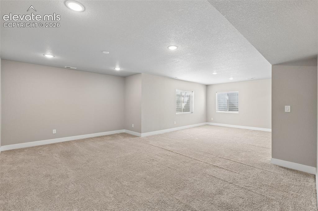 Image 21 of 40: Neutral interior featuring wall-to-wall carpeting, recessed ceiling lightin
