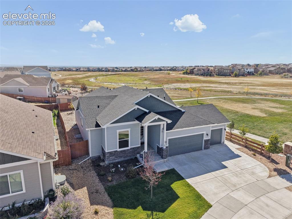 Image 31 of 40: Single-story residence featuring composite shingle roofing, horizontal lap 