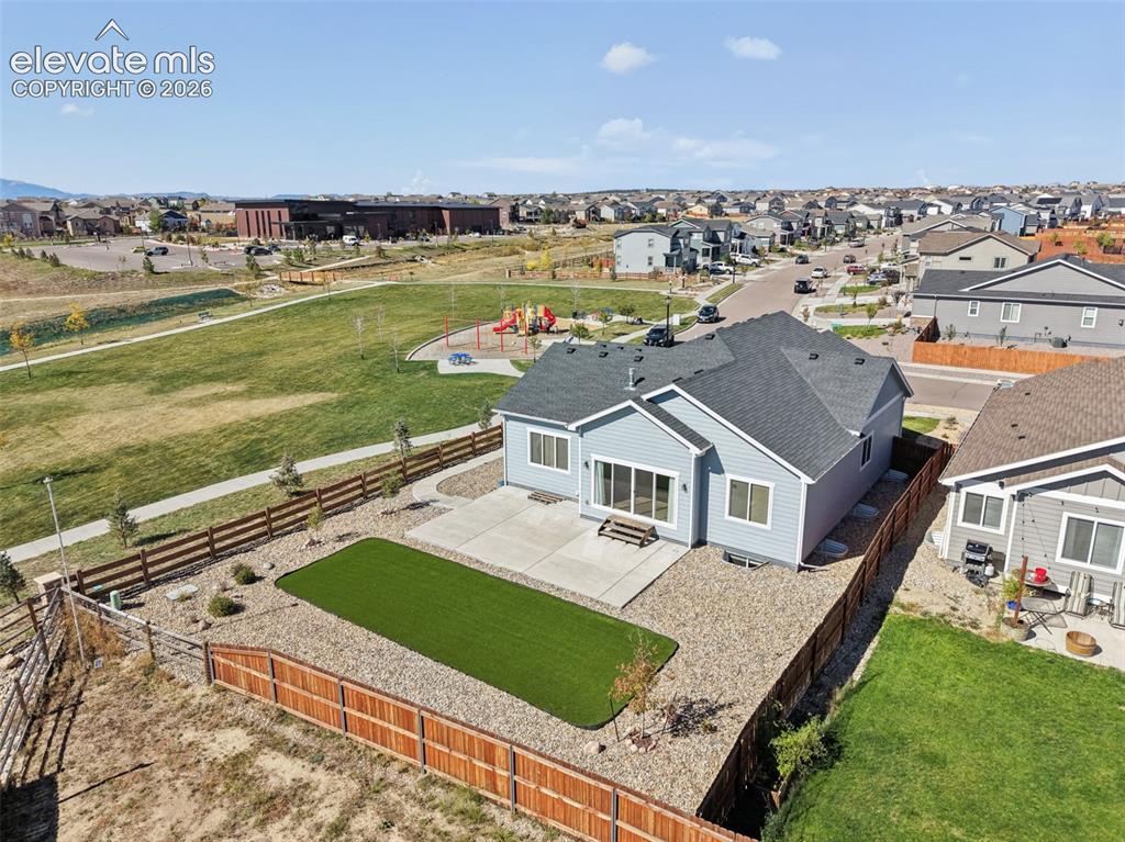 Image 35 of 40: Exterior featuring a light blue siding finish, a concrete patio, a fenced b