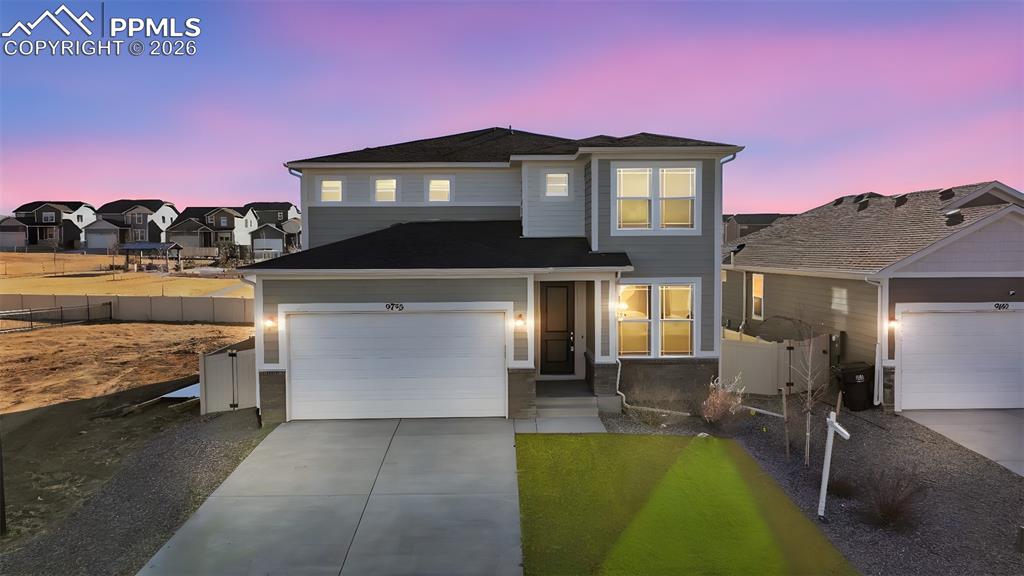 Image 1 of 48: View of front of house featuring turf and a 3 car garage