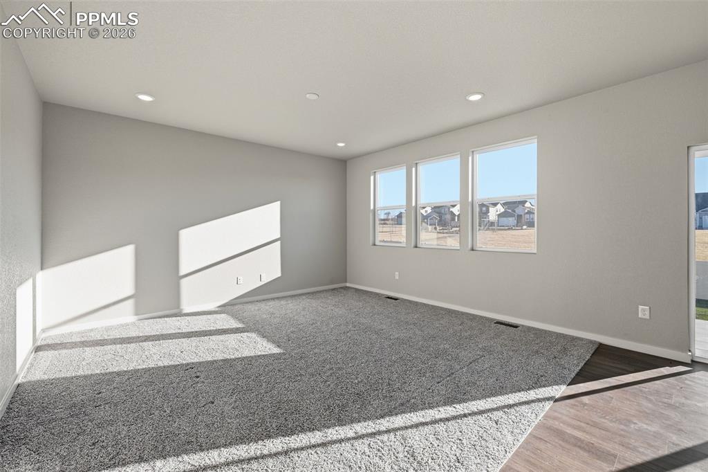 Image 11 of 48: Spare room featuring recessed lighting and light wood-style floors