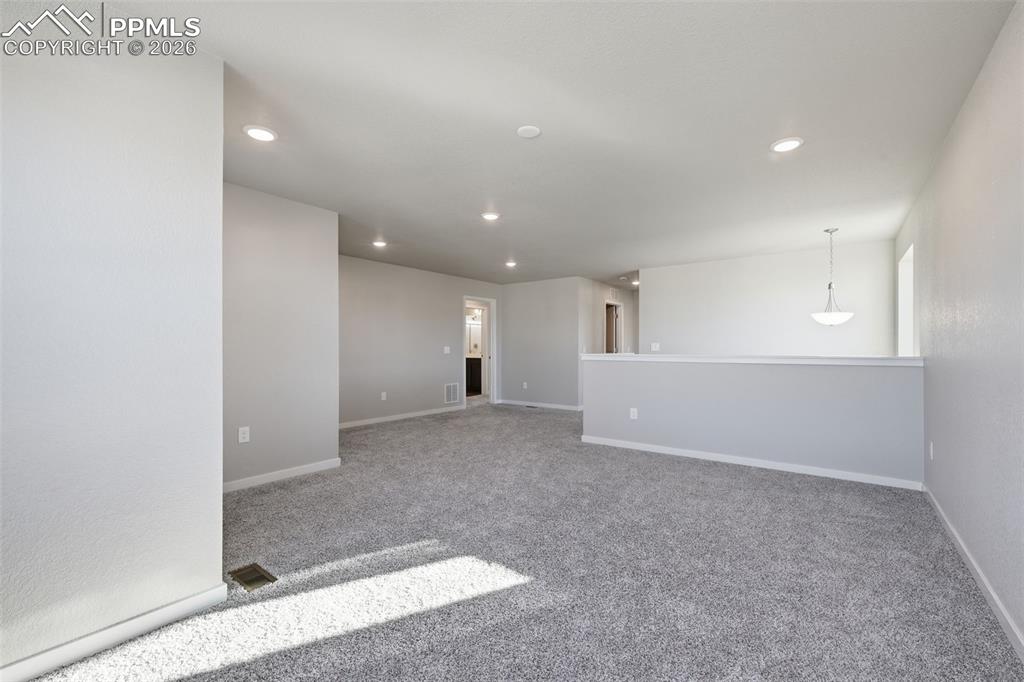 Image 19 of 48: Spare room with light carpet and recessed lighting