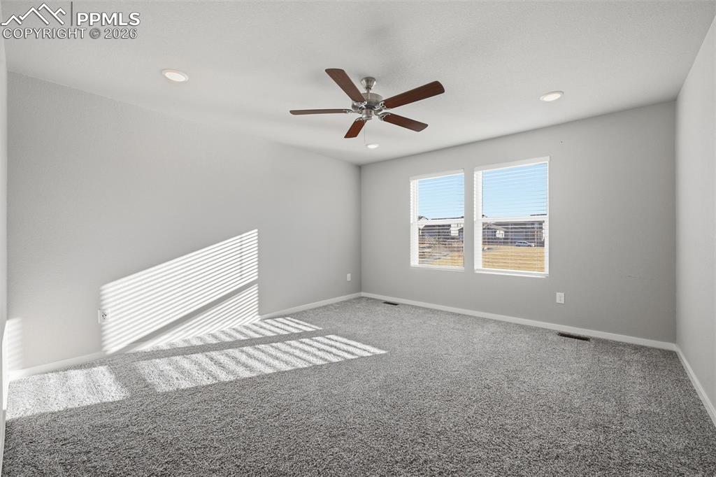 Image 23 of 48: Unfurnished room with carpet flooring, a ceiling fan, and recessed lighting